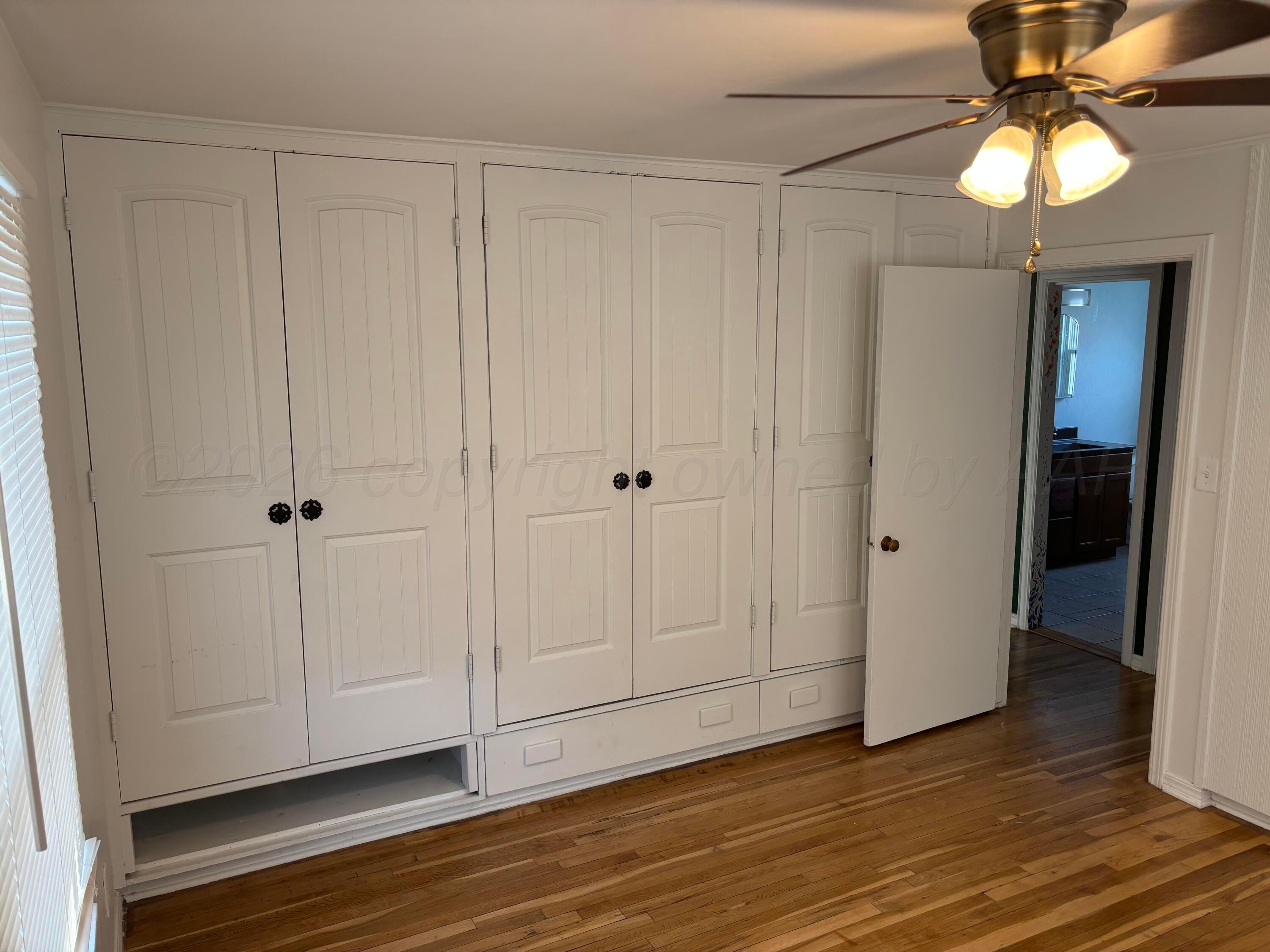4014 Cline Road Amarillo, TX 79110 - Photo 7 of 21 a view of an empty room with wooden floor