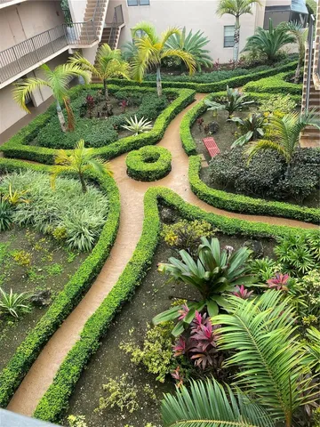 a view of a swimming pool with a yard