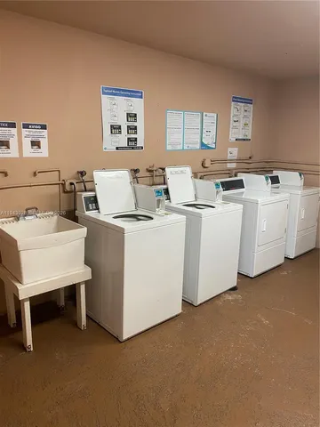 a view of living room with furniture and window