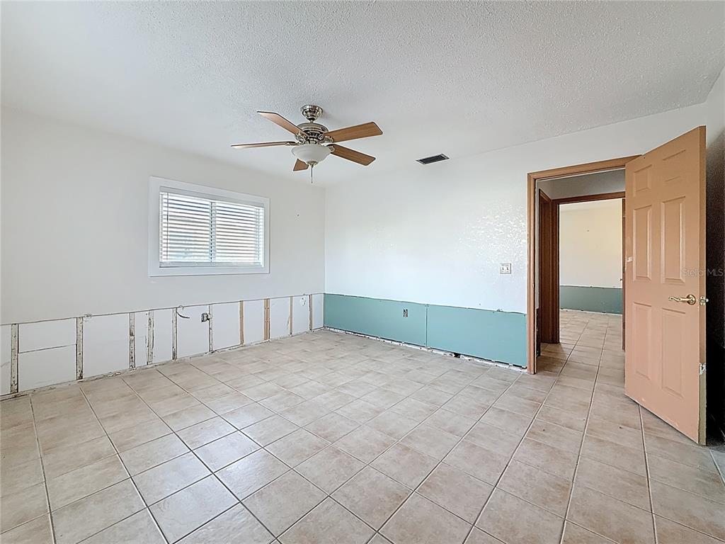 4869 Shell Stream Boulevard New Port Richey, FL 34652 - Photo 27 of 46 a view of an empty room with a window