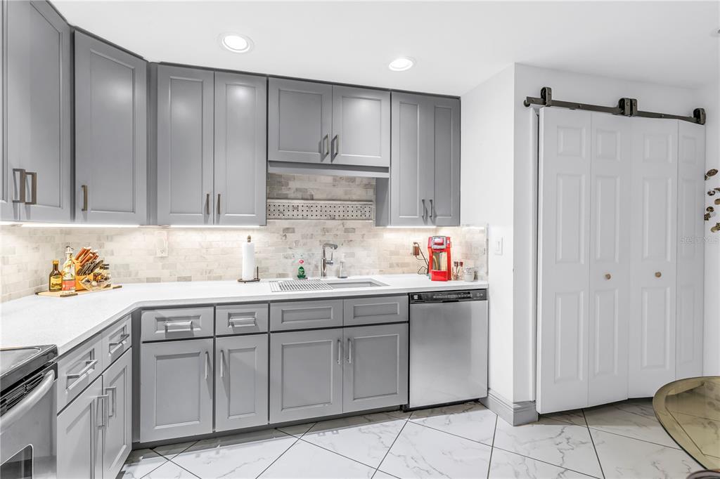 415 Spring Lakes Boulevard, Unit 415D Bradenton, FL 34210 - Photo 13 of 52 a kitchen with a sink cabinets and appliances