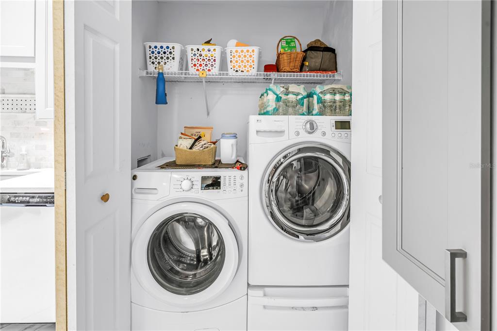 415 Spring Lakes Boulevard, Unit 415D Bradenton, FL 34210 - Photo 17 of 52 a utility room with dryer and washer