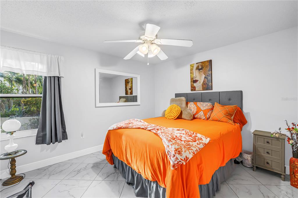 415 Spring Lakes Boulevard, Unit 415D Bradenton, FL 34210 - Photo 23 of 52 a bedroom with a bed and a window