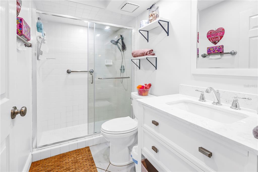 415 Spring Lakes Boulevard, Unit 415D Bradenton, FL 34210 - Photo 25 of 52 a bathroom with a sink toilet and shower