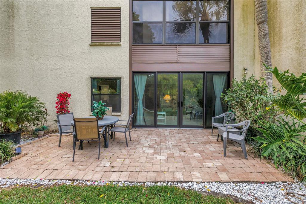 415 Spring Lakes Boulevard, Unit 415D Bradenton, FL 34210 - Photo 32 of 52 a view of a house with backyard sitting area and garden