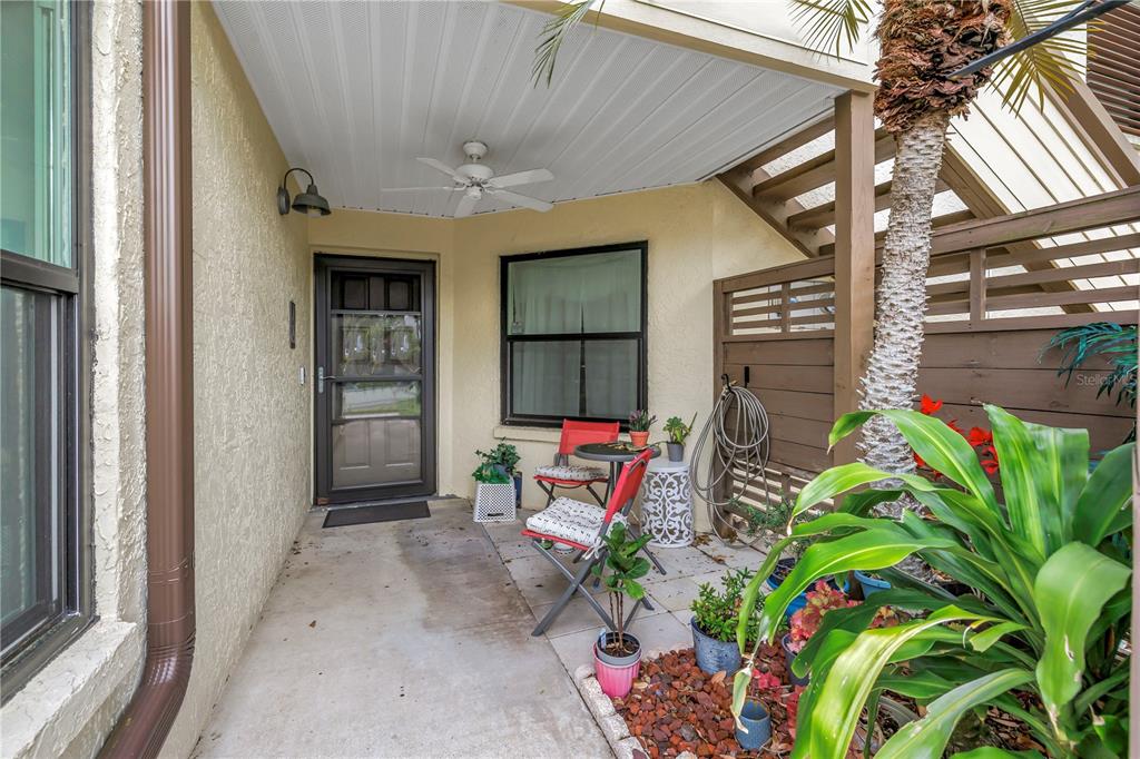 415 Spring Lakes Boulevard, Unit 415D Bradenton, FL 34210 - Photo 39 of 52 a backyard of a house with outdoor seating