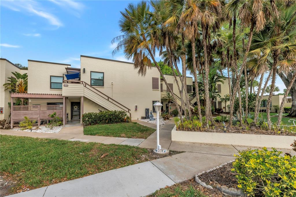 415 Spring Lakes Boulevard, Unit 415D Bradenton, FL 34210 - Photo 40 of 52 a front view of a house with a yard