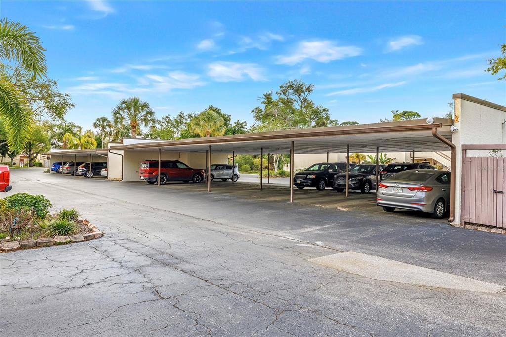 415 Spring Lakes Boulevard, Unit 415D Bradenton, FL 34210 - Photo 45 of 52 a view of a cars park in front of a building