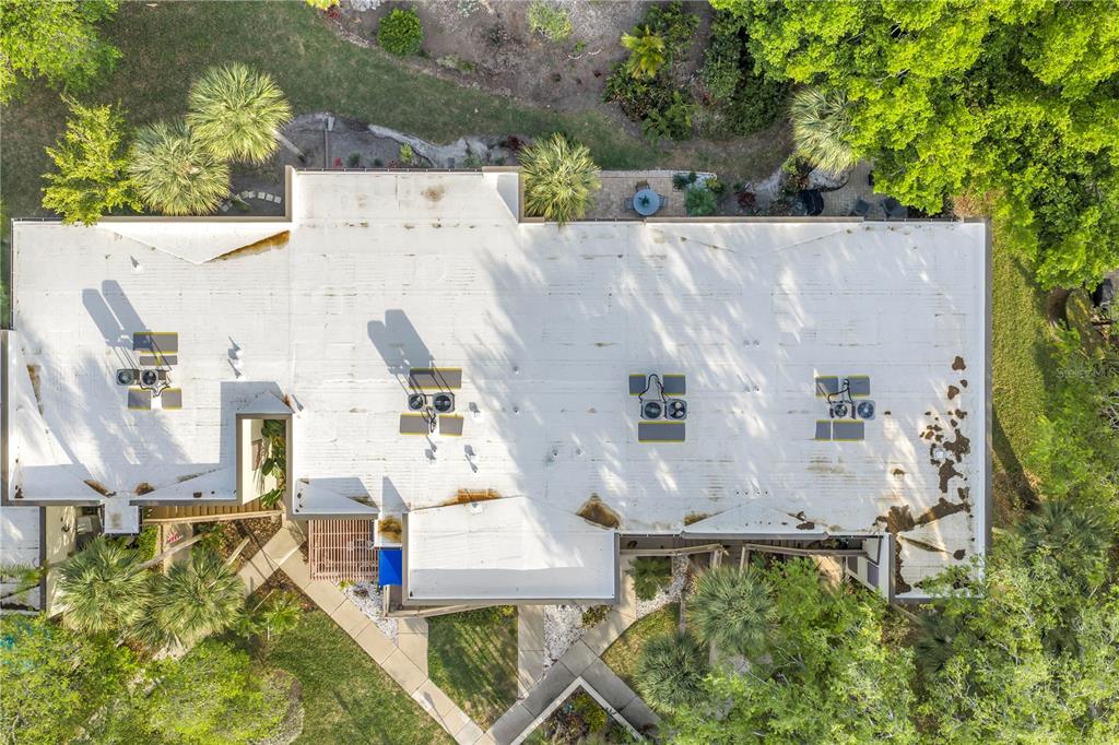 415 Spring Lakes Boulevard, Unit 415D Bradenton, FL 34210 - Photo 49 of 52 an aerial view of residential house with outdoor space and trees