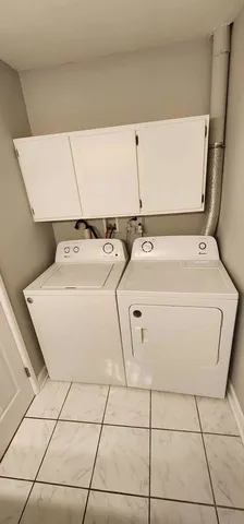 a utility room with washer and dryer