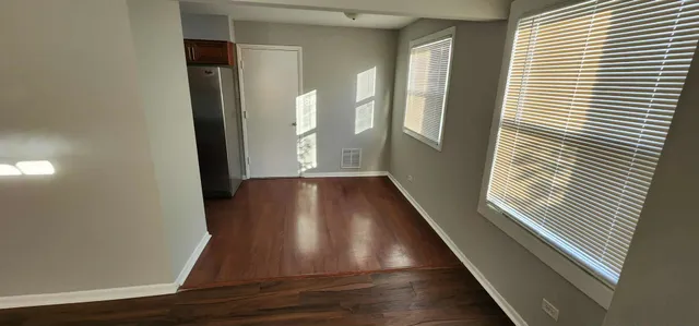 a view of entryway with wooden floor