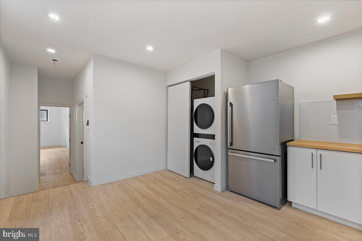 3907 Spring Garden Street, Unit 1 Philadelphia, PA 19104 - Photo 21 of 33 a view of a kitchen with a refrigerator and washer