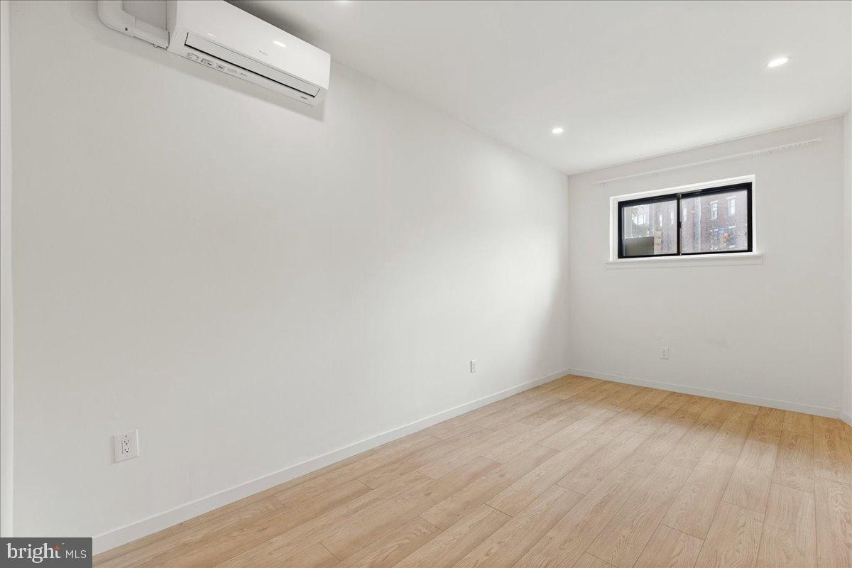 3907 Spring Garden Street, Unit 1 Philadelphia, PA 19104 - Photo 25 of 33 a view of a room with wooden floor and window