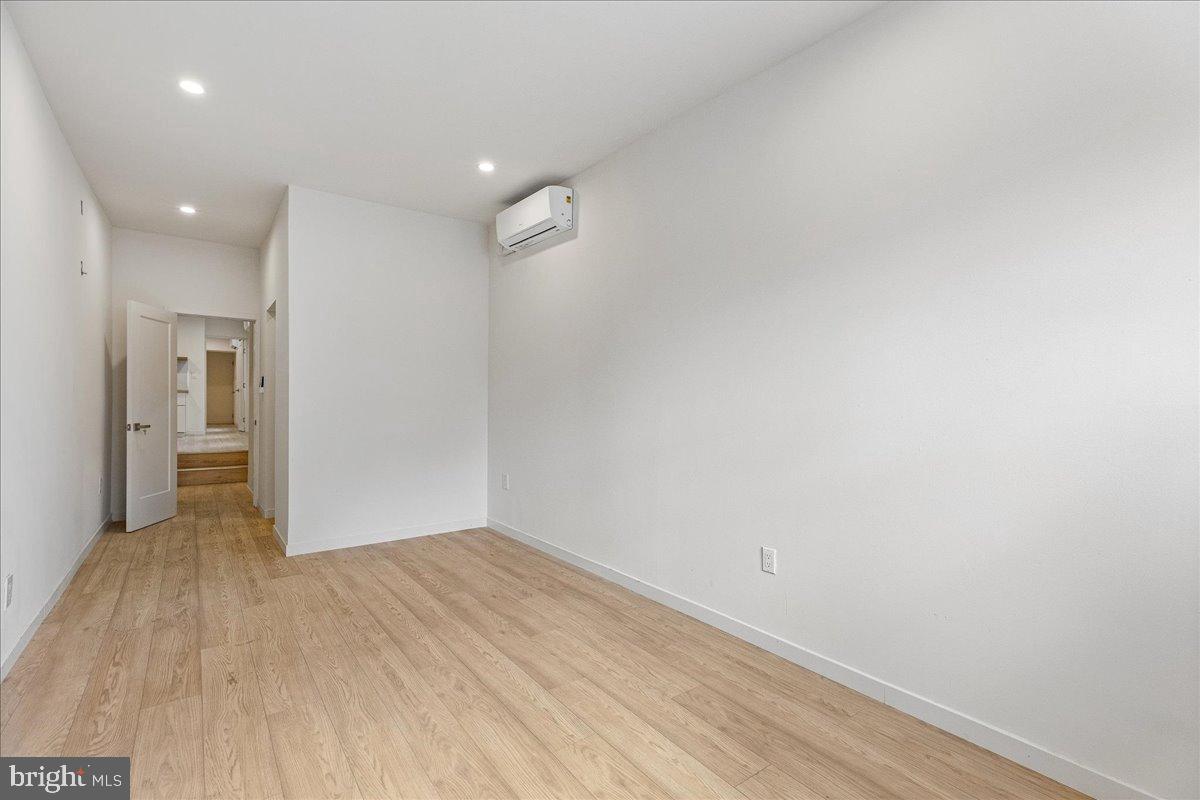 3907 Spring Garden Street, Unit 1 Philadelphia, PA 19104 - Photo 26 of 33 a view of hallway with wooden floor