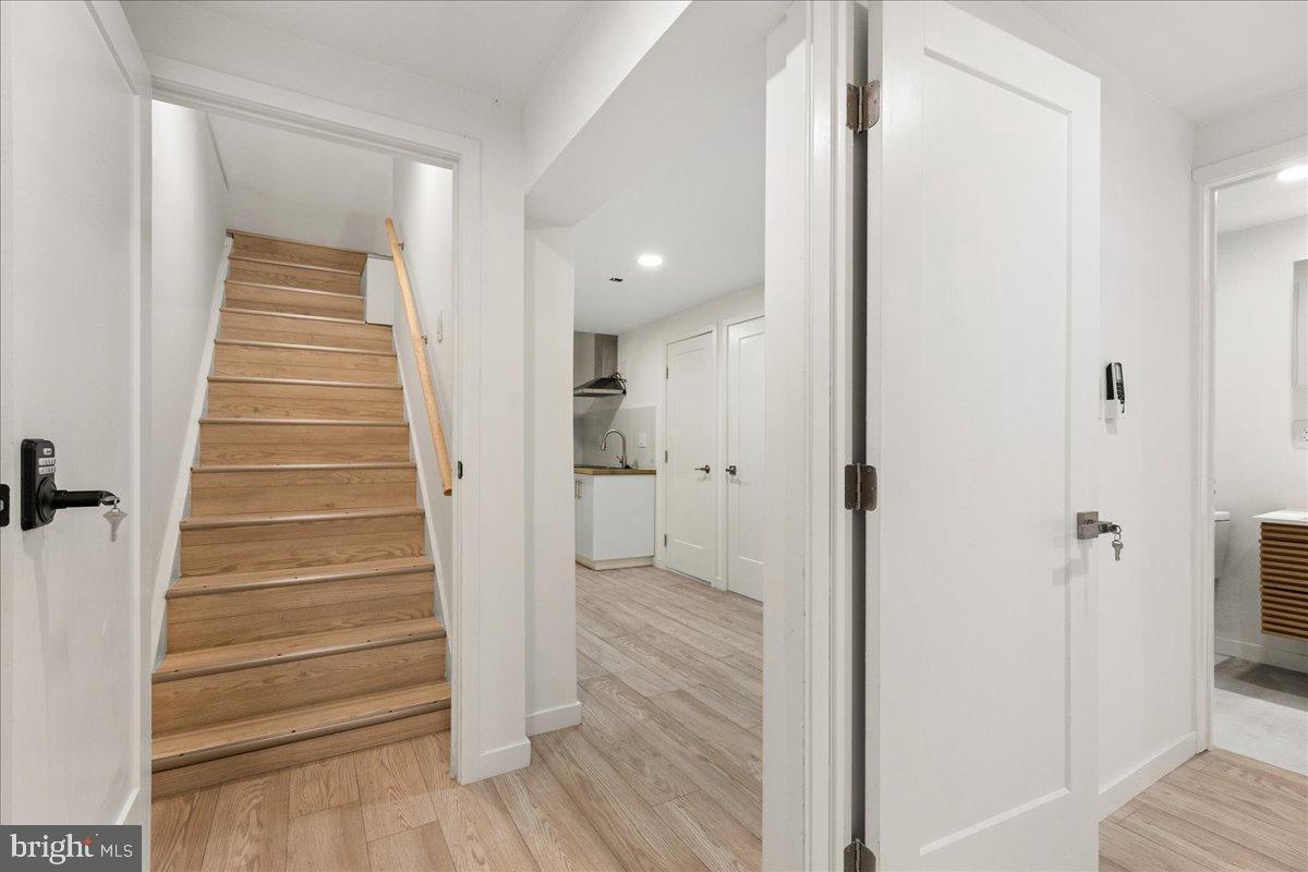 3907 Spring Garden Street, Unit 1 Philadelphia, PA 19104 - Photo 4 of 33 a view of a hallway with wooden floor and entryway