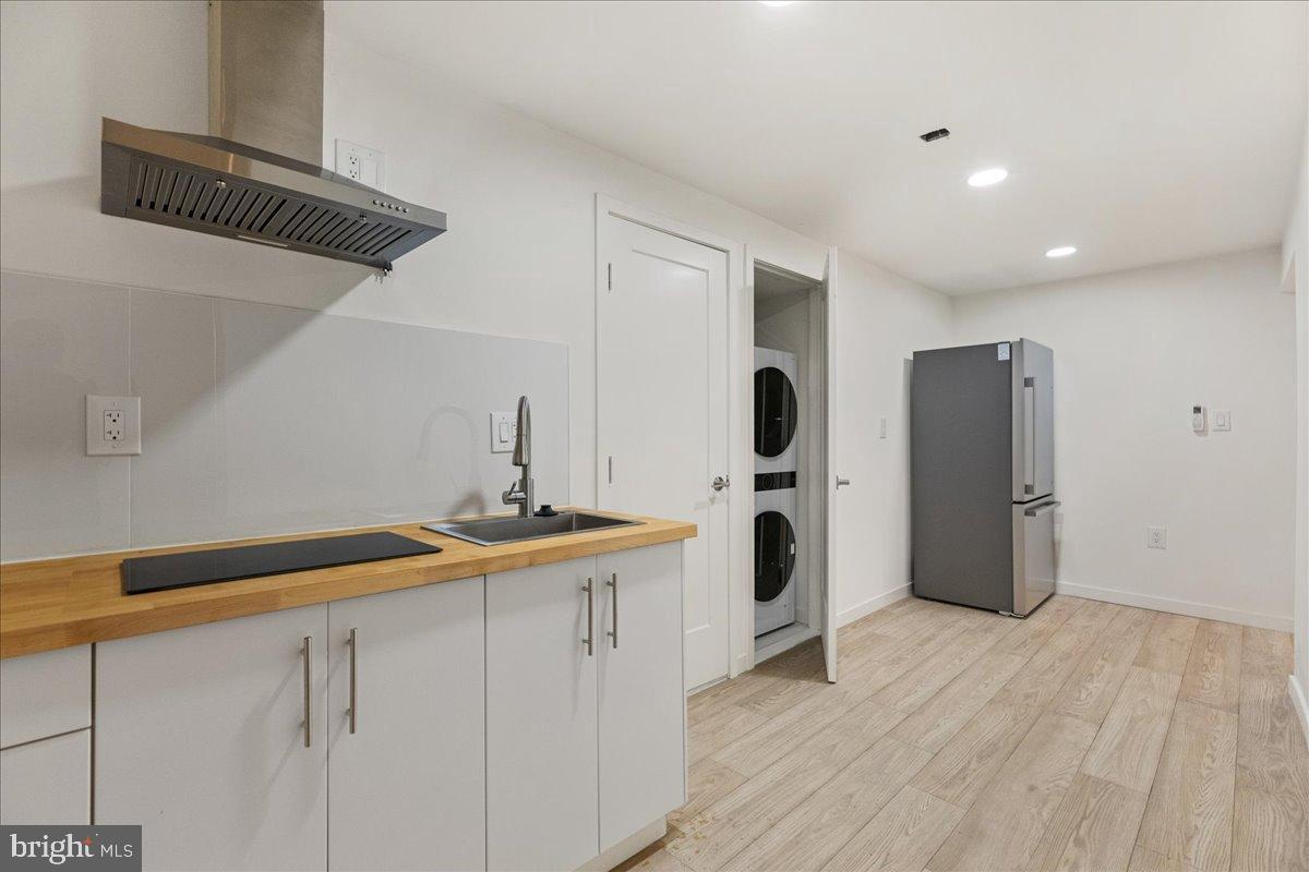 3907 Spring Garden Street, Unit 1 Philadelphia, PA 19104 - Photo 7 of 33 a kitchen with a sink and refrigerator