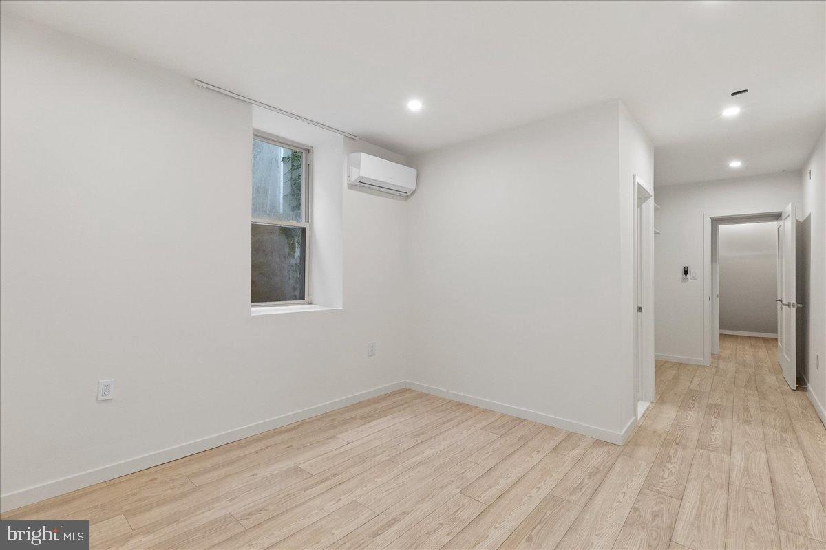 3907 Spring Garden Street, Unit 1 Philadelphia, PA 19104 - Photo 10 of 33 a view of a room with wooden floor and white walls