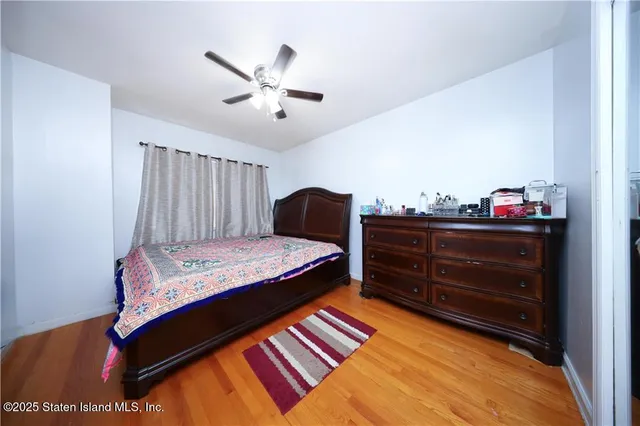 a bedroom with a bed and cabinet