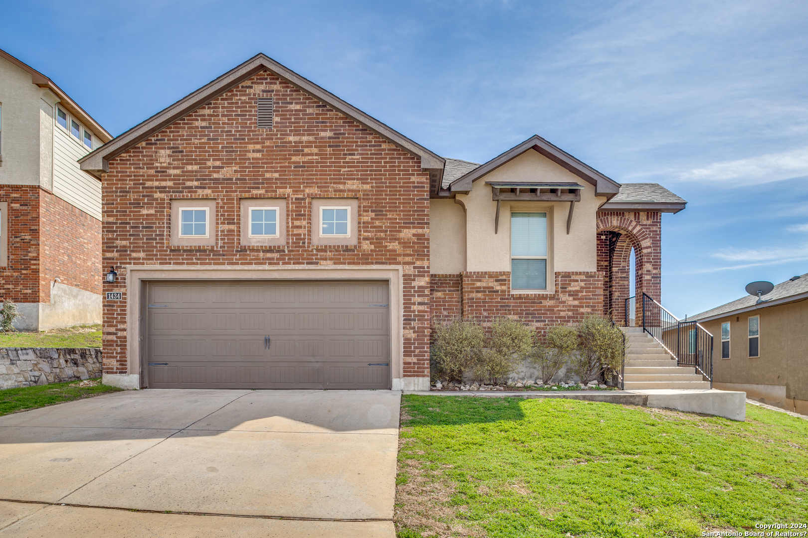 1434 Rock Dove Road San Antonio, TX 78260 - Photo 1 of 1 a front view of a house with a yard and garage
