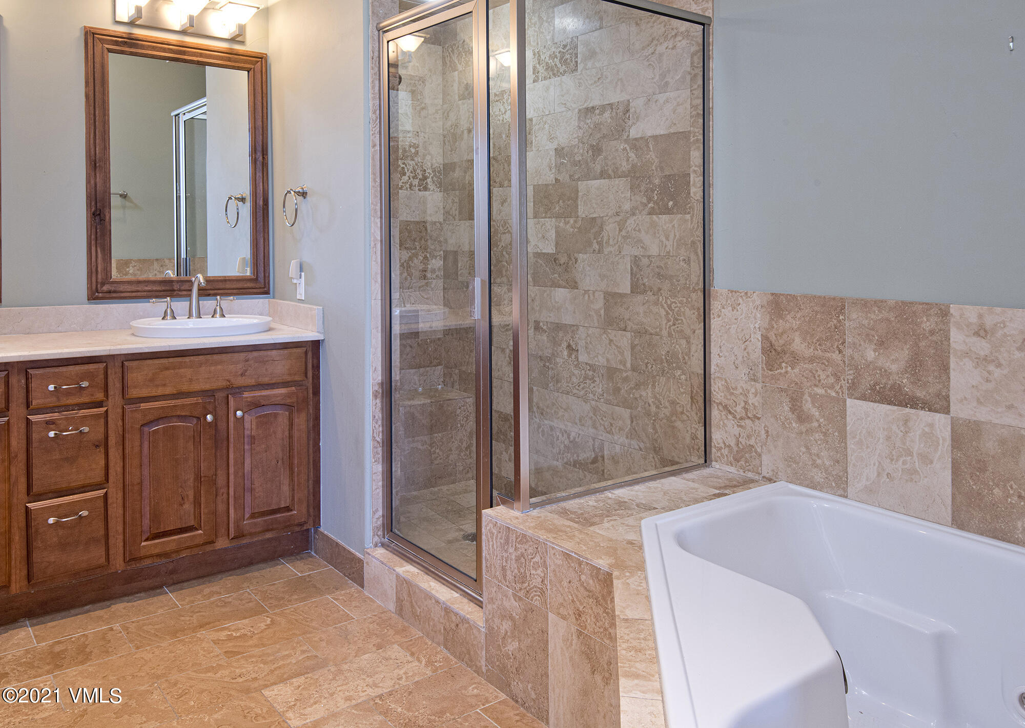 295 Main Street, Unit R201 Edwards, CO 81632 - Photo 14 of 36 a bathroom with a tub sink and mirror