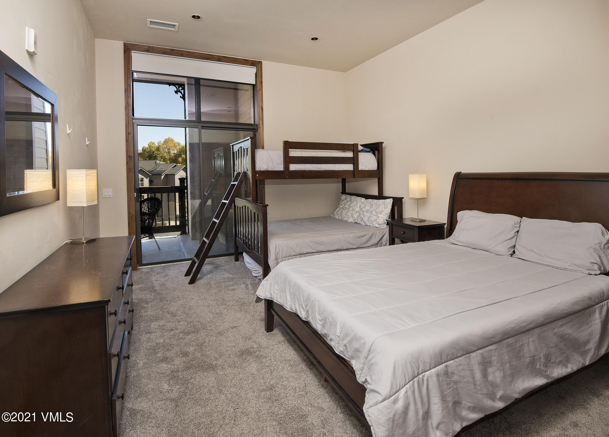 295 Main Street, Unit R201 Edwards, CO 81632 - Photo 18 of 36 a bed room with two bed and a window