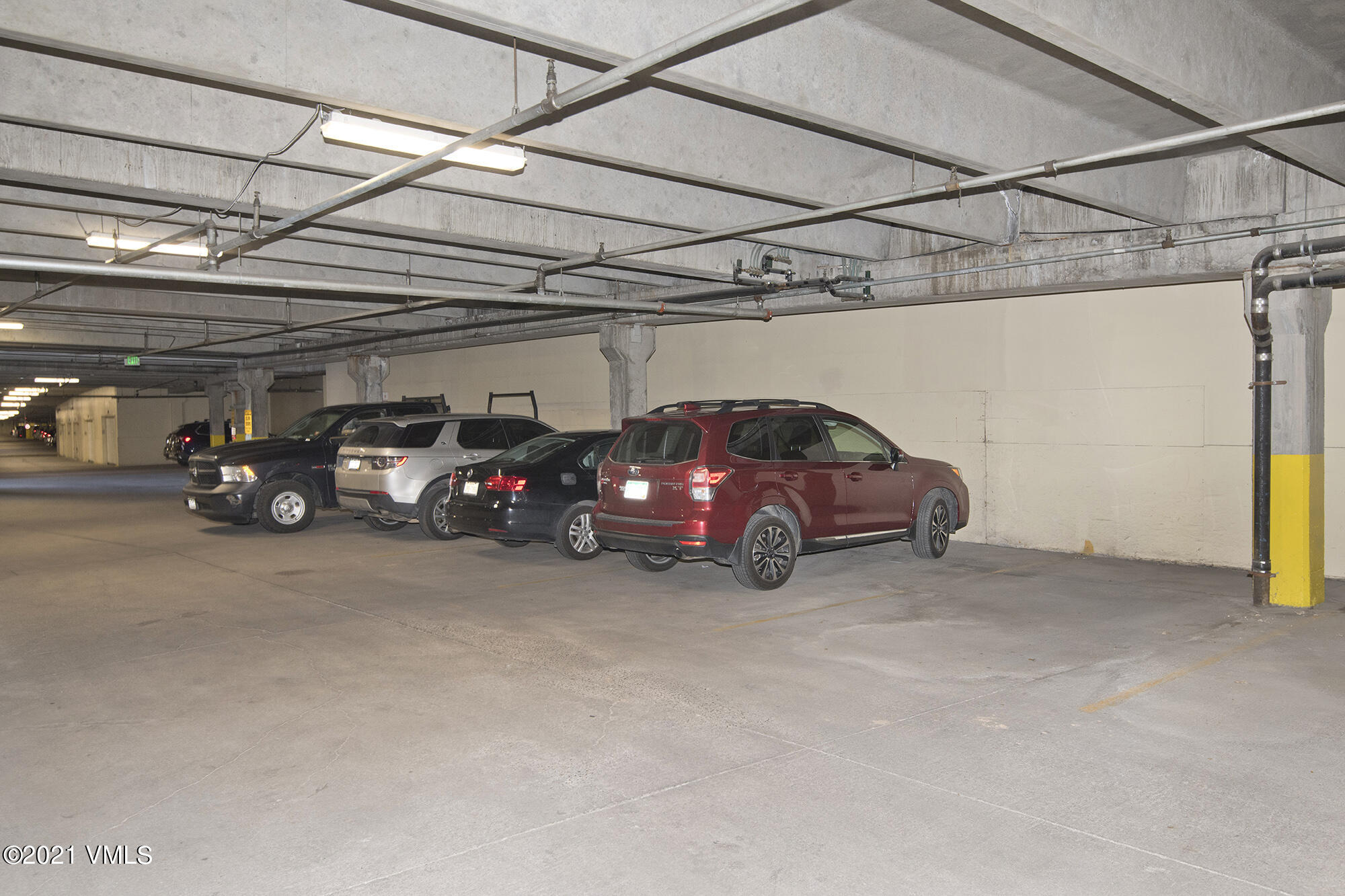 295 Main Street, Unit R201 Edwards, CO 81632 - Photo 28 of 36 a view of a cars parked in garage