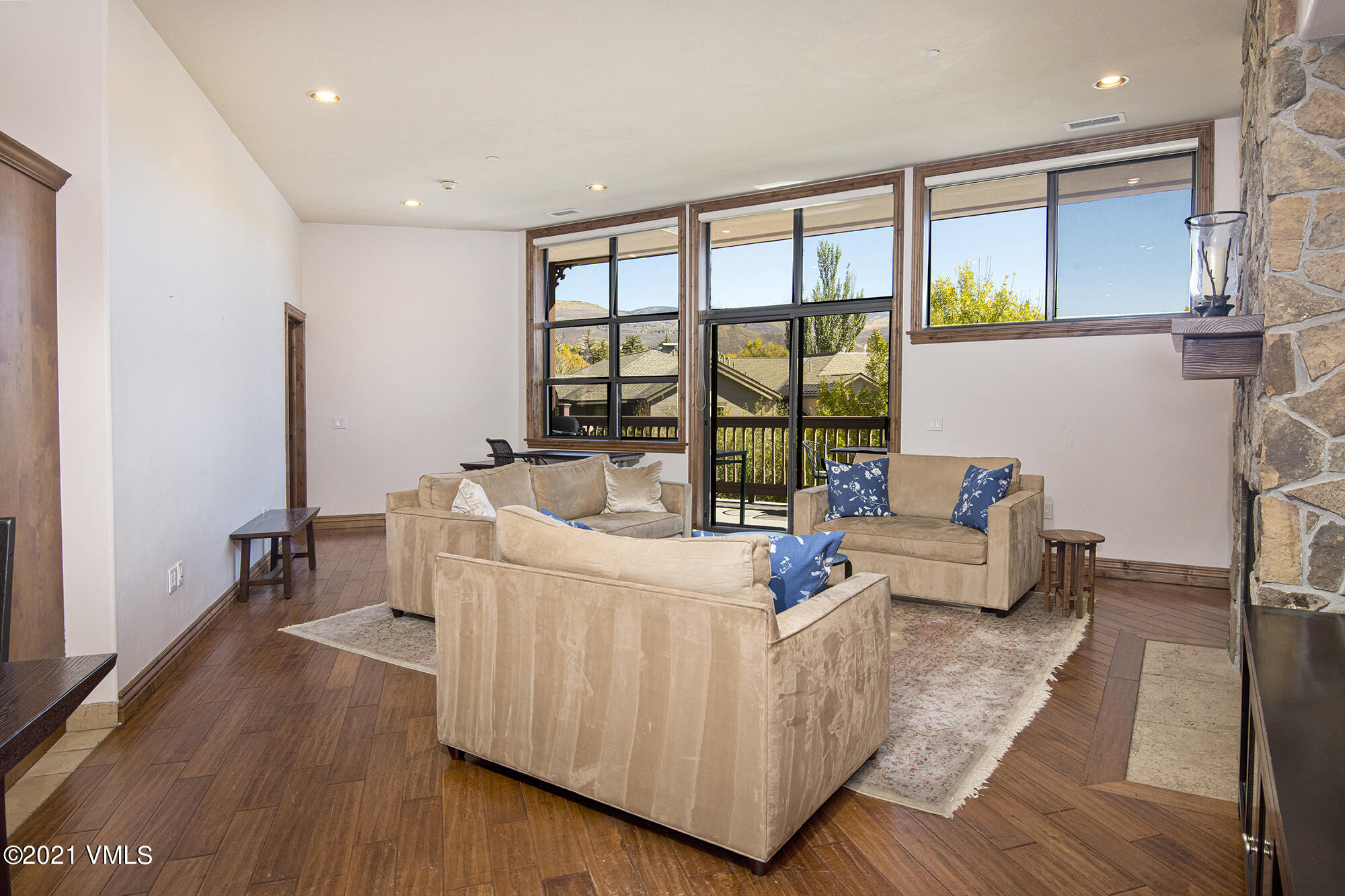 295 Main Street, Unit R201 Edwards, CO 81632 - Photo 8 of 36 a living room with furniture and a large window