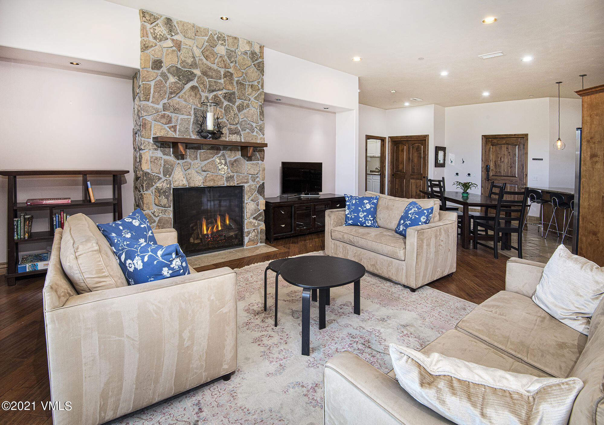 295 Main Street, Unit R201 Edwards, CO 81632 - Photo 9 of 36 a living room with furniture and a fireplace
