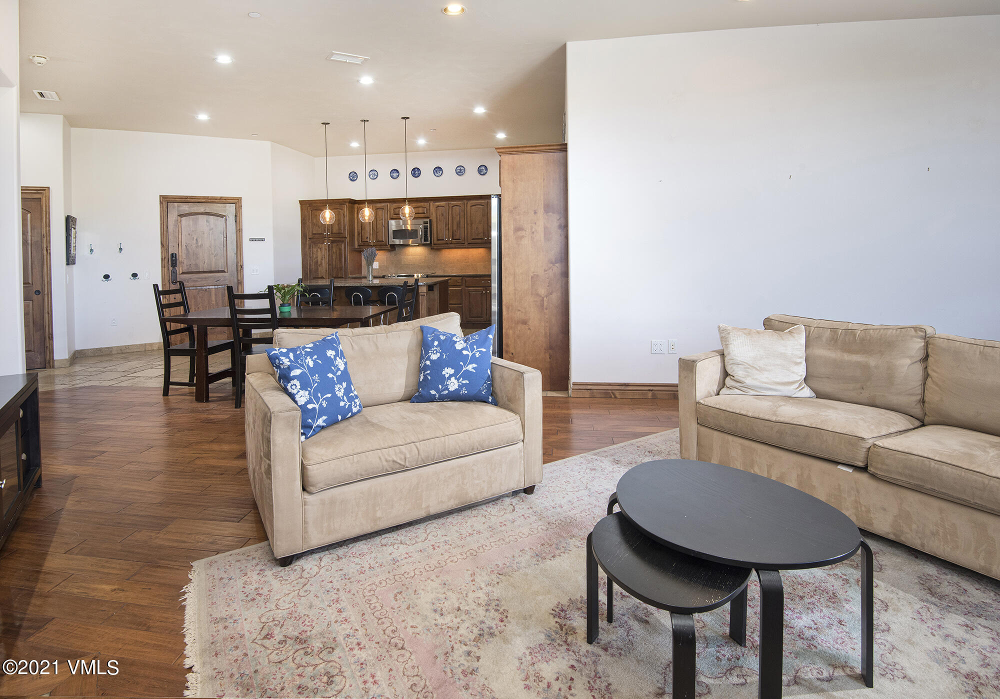 295 Main Street, Unit R201 Edwards, CO 81632 - Photo 10 of 36 a living room with furniture and a table