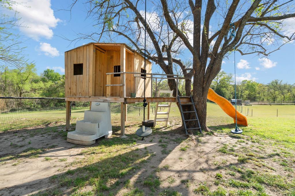 112 Waterfall Court Azle, TX 76020 - Photo 36 of 40 a view of a house with backyard