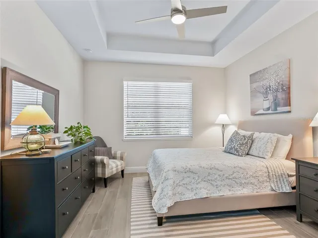 a bedroom with a bed and a dresser