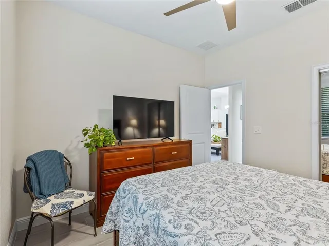 a bathroom with a granite countertop sink a toilet and a mirror