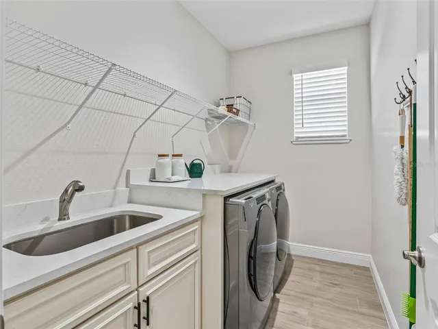 a view of a room with furniture and a large window