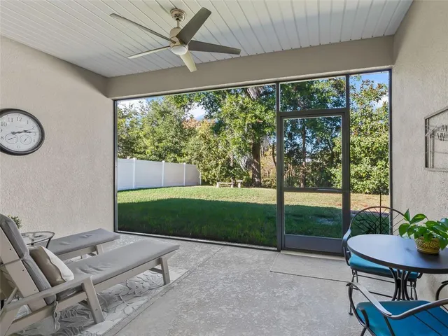 a view of a room that has a table and a chair