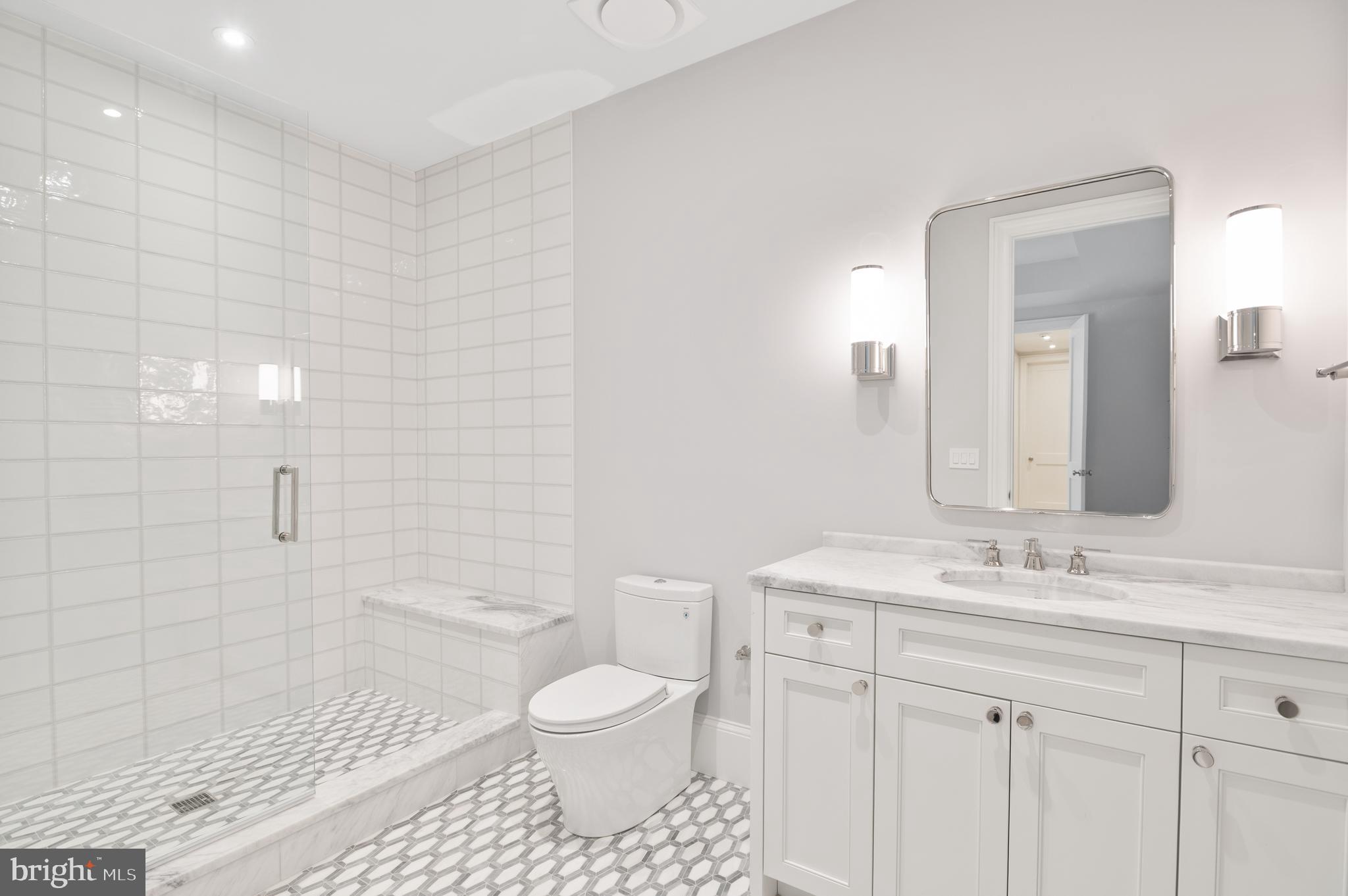 2604 36th Street Northwest Washington, DC 20007 - Photo 29 of 38 a bathroom with a sink a toilet and shower