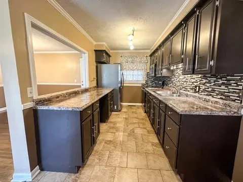 a kitchen with stainless steel appliances granite countertop a stove and a sink