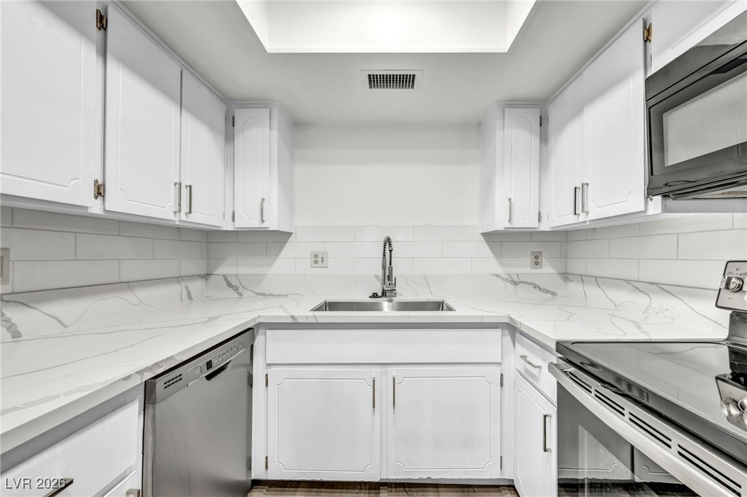 647 Pepper Tree Circle Henderson, NV 89014 - Photo 15 of 34 sink and dishwasher