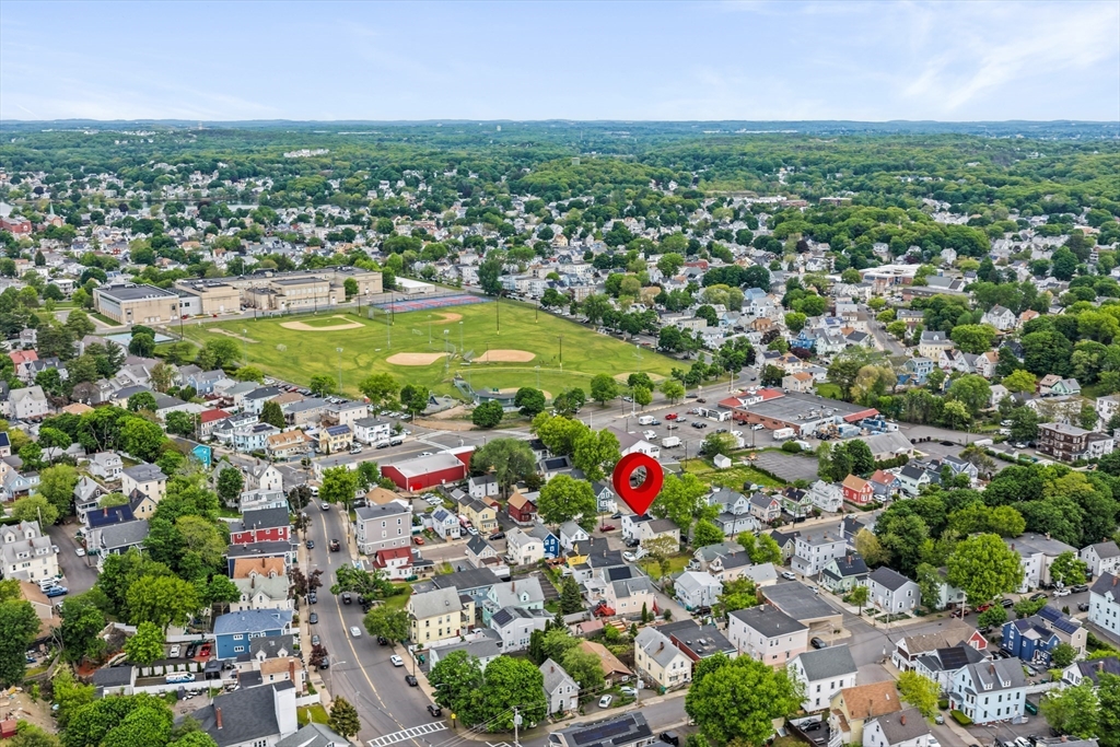 23 Logan Street Lynn, MA 01902 - Photo 25 of 27 an aerial view of residential houses with outdoor space and trees