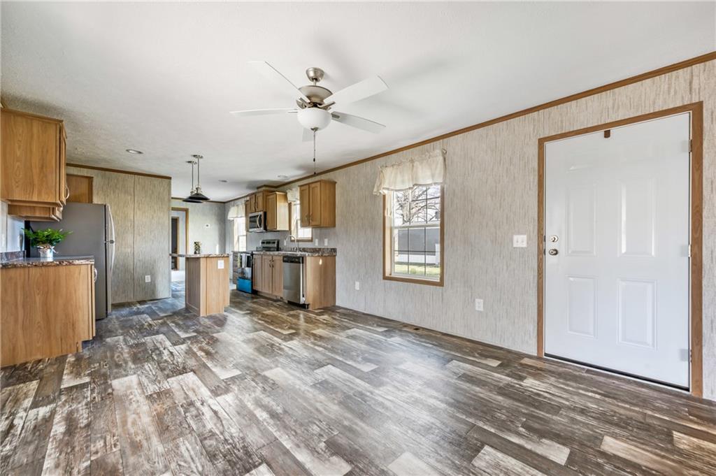 69 South Summit Road, Unit 102 Greenville, PA 16125 - Photo 3 of 24 a view of a kitchen with a refrigerator cabinets and a wooden floor