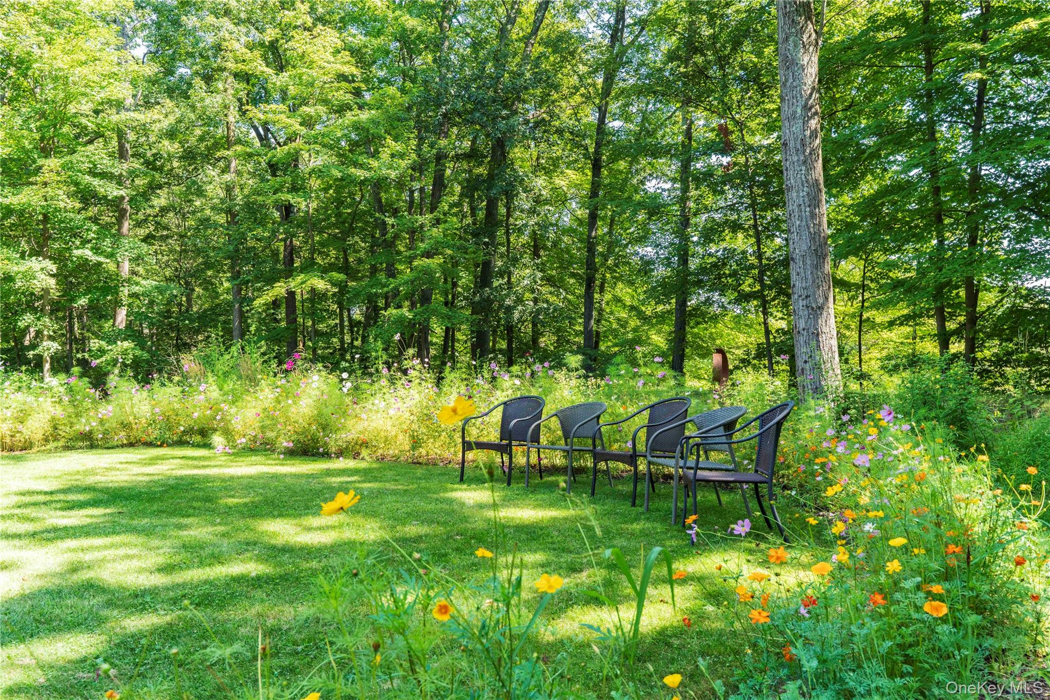105 Iron Mountain Road Warwick, NY 10990 - Photo 14 of 49 a view of a bench in a garden