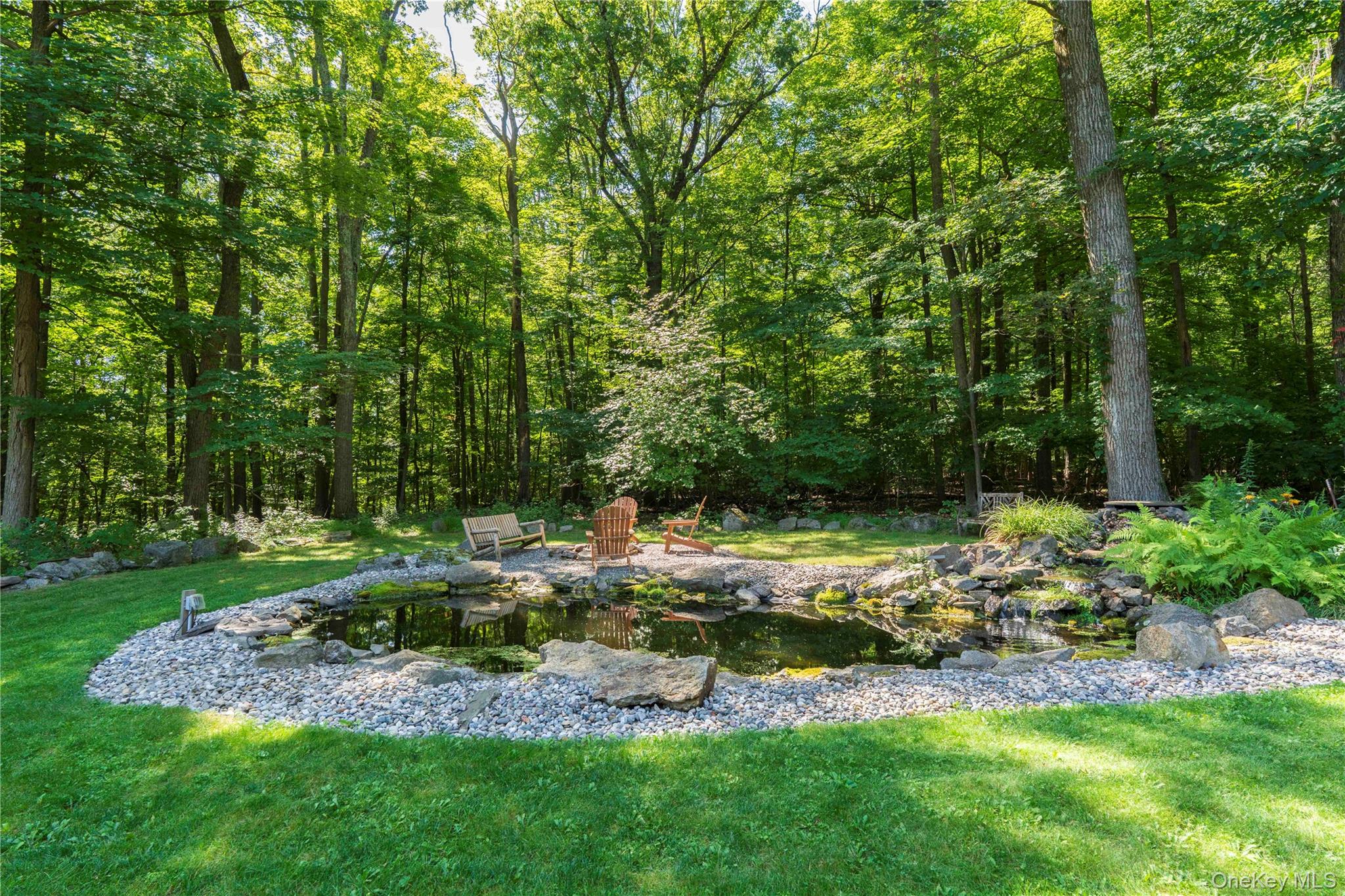 105 Iron Mountain Road Warwick, NY 10990 - Photo 15 of 49 a view of a backyard with large trees