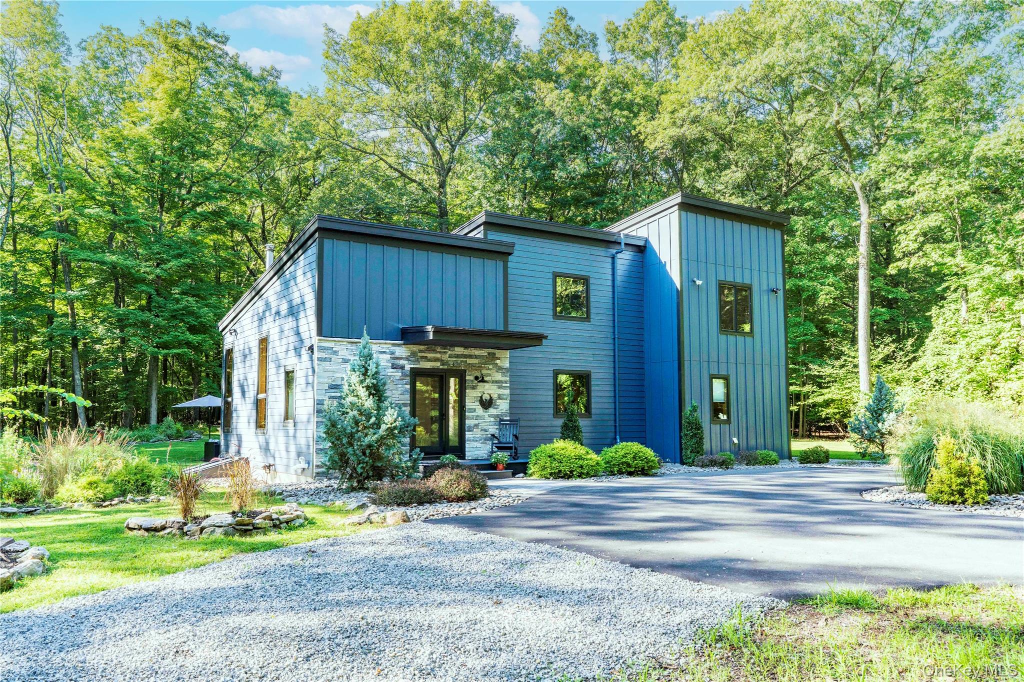 105 Iron Mountain Road Warwick, NY 10990 - Photo 18 of 49 a view of a house with backyard and trees