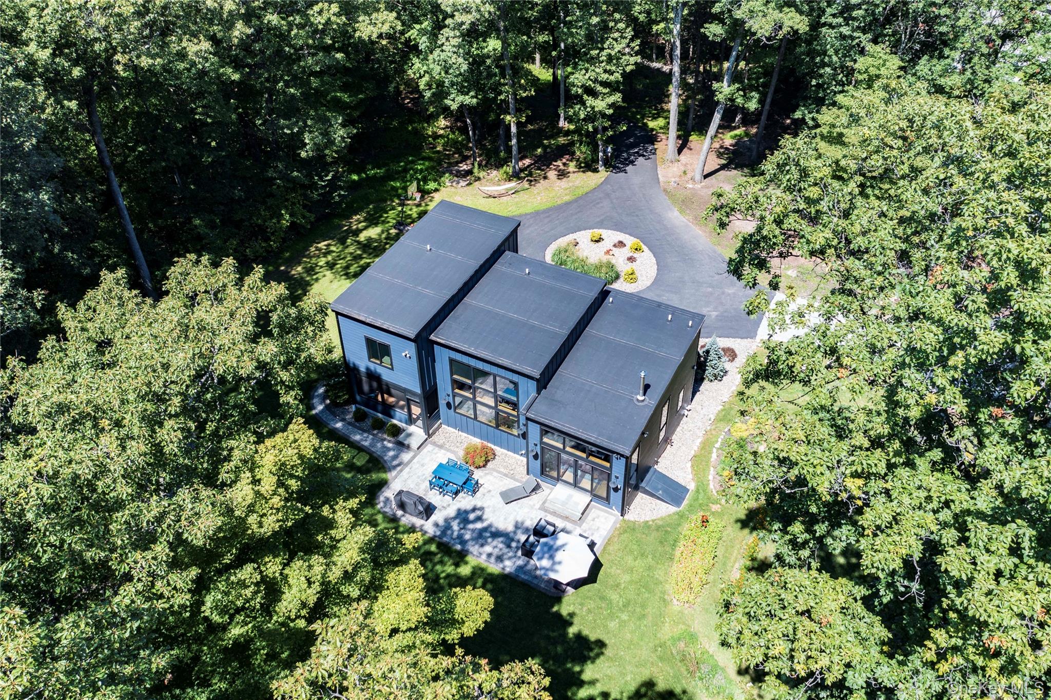 105 Iron Mountain Road Warwick, NY 10990 - Photo 4 of 49 an aerial view of a house with yard swimming pool and outdoor seating