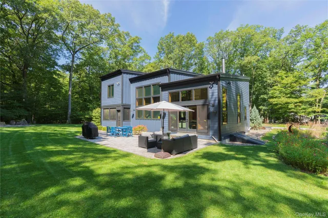 a front view of house with yard and green space
