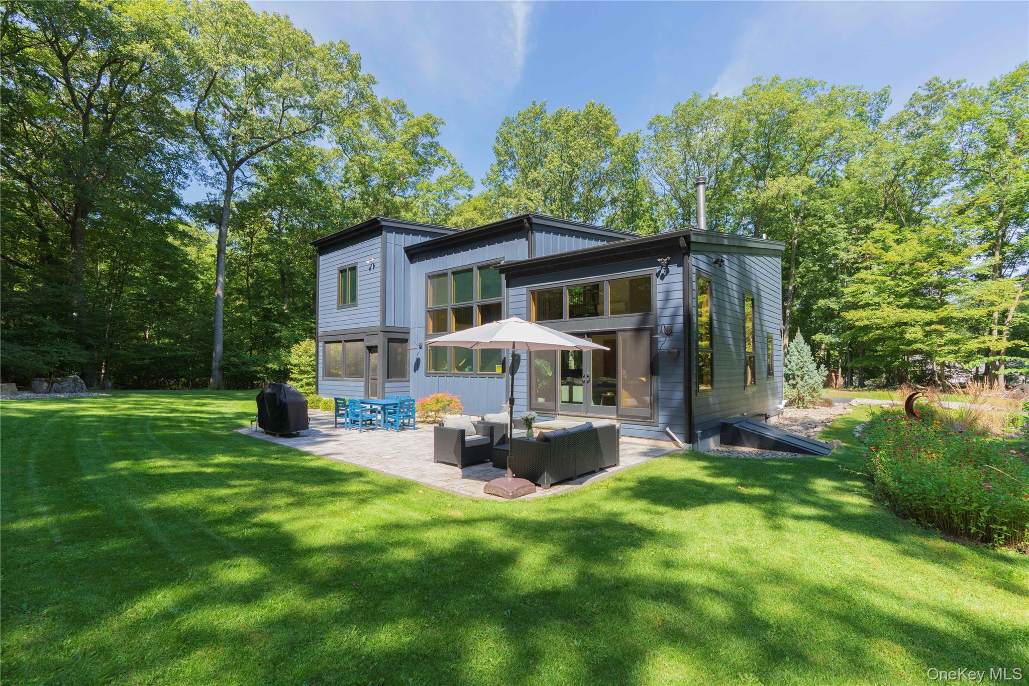 105 Iron Mountain Road Warwick, NY 10990 - Photo 7 of 49 a front view of house with yard and green space