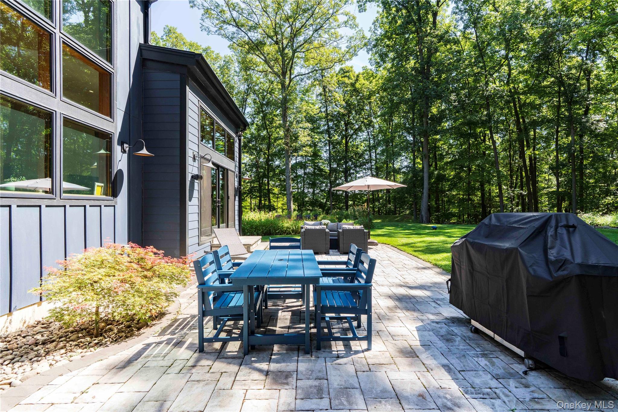 105 Iron Mountain Road Warwick, NY 10990 - Photo 10 of 49 a view of a patio with a table chairs and a patio