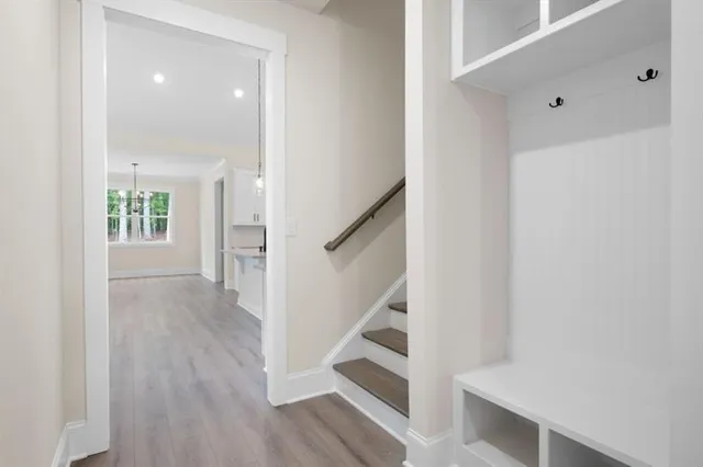 a view of entryway with wooden floor and stair