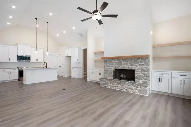 a view of a kitchen with furniture and a fireplace