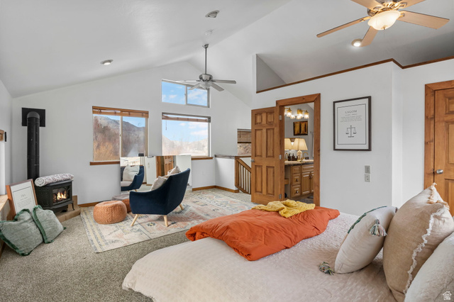 2189 Samak Park Loop, Unit 43 Kamas, UT 84036 - Photo 22 of 48 Carpeted bedroom featuring ceiling fan, a wood stove, high vaulted ceiling, and ensuite bath