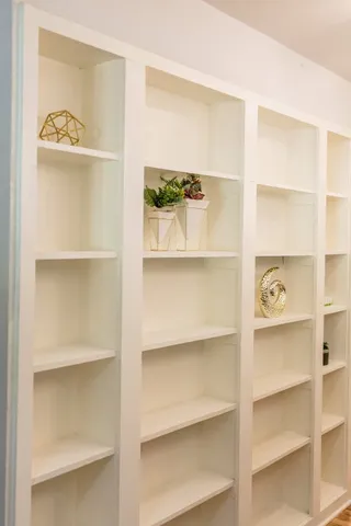 a view of room with wooden floor